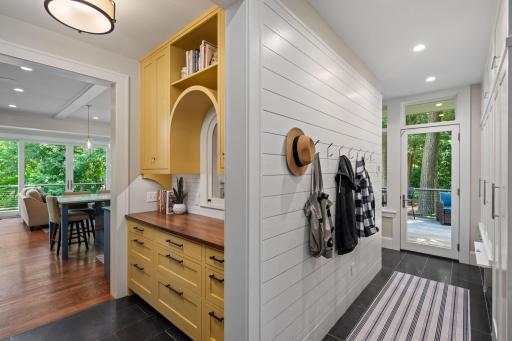 Mudroom and drop zone with pantry pass-through