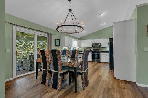 Indoor/outdoor living is simplified with the easy access to the screened back deck