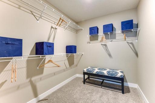 Large walk-in closet in the primary bedroom provides you with ample storage space. **Pictures are of model home; actual finishes will vary.