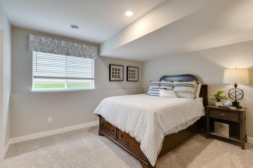 Oversized bedroom in the basement comes with its own private walk-in closet. **Pictures are of model home; actual finish may vary.