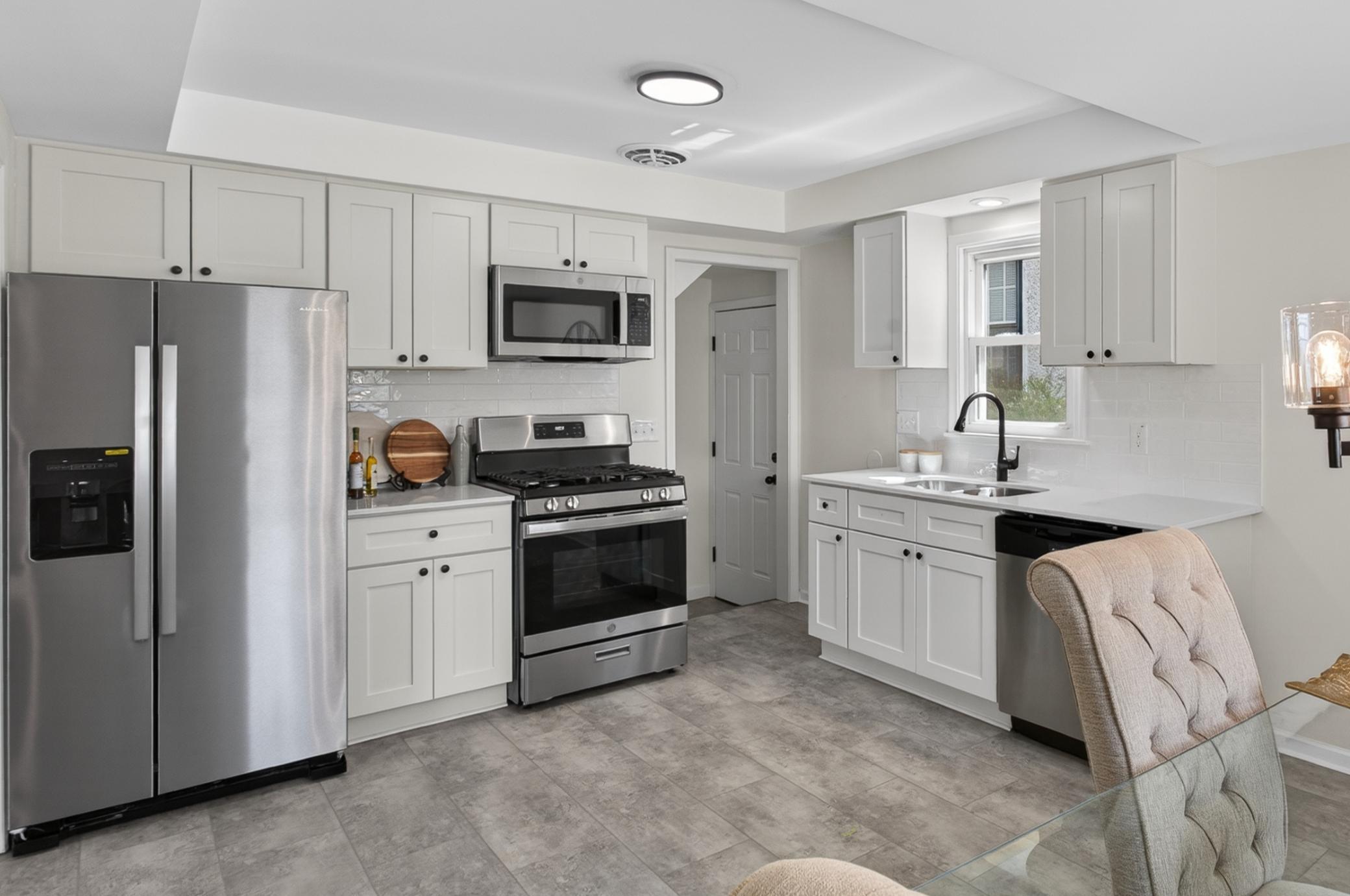 Main level: brand new kitchen with quartz counters and stainless appliances