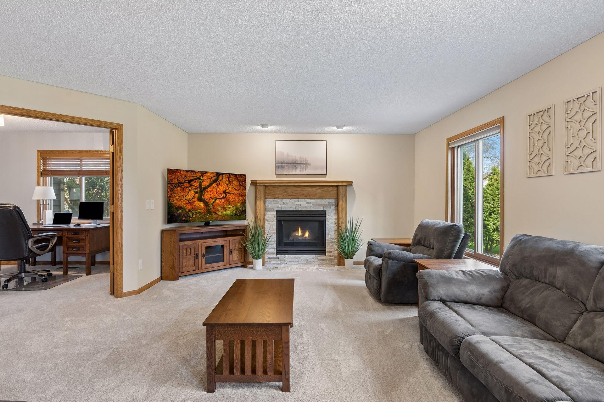 Check out the nicely sized family room, with recently updated fireplace and more backyard views.