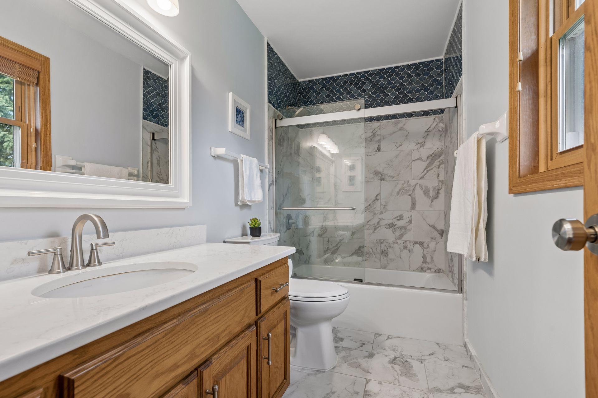 Primary bathroom was recently updated, with custom floor and shower tile.