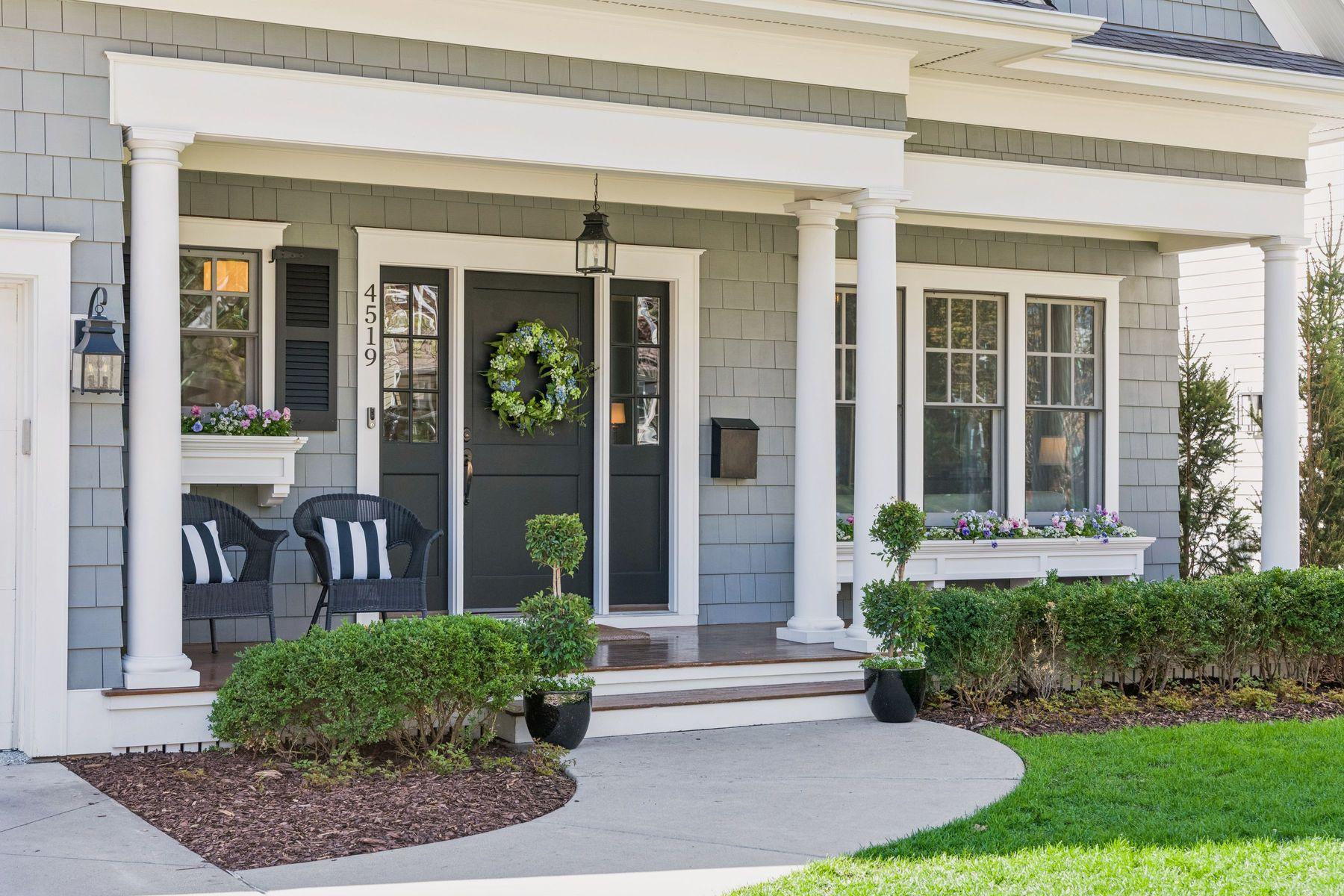 Darling front porch, cedar shakes, window box perfection.