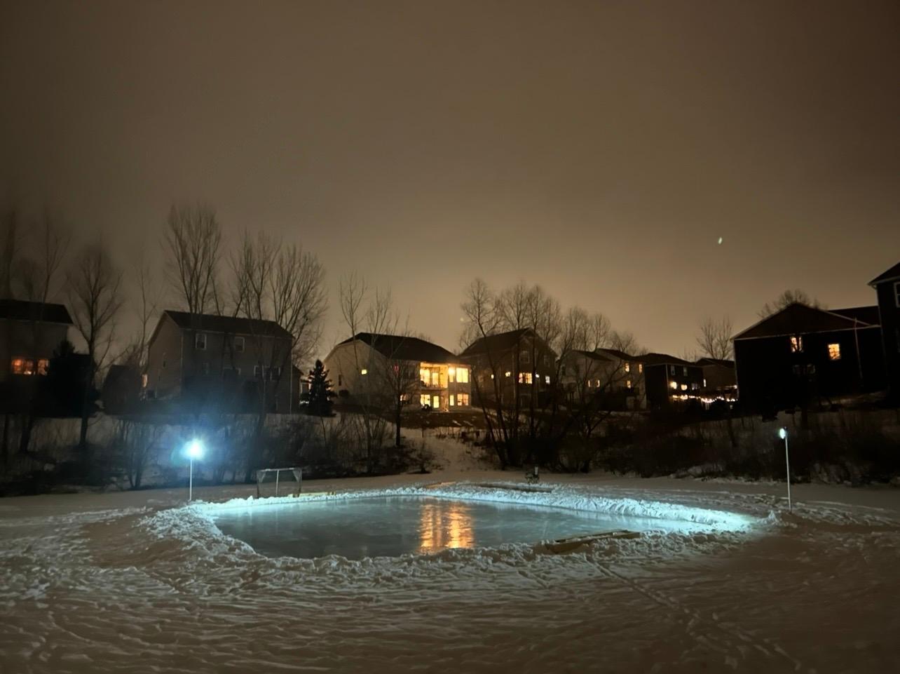 A view of the ice rink in the evening.