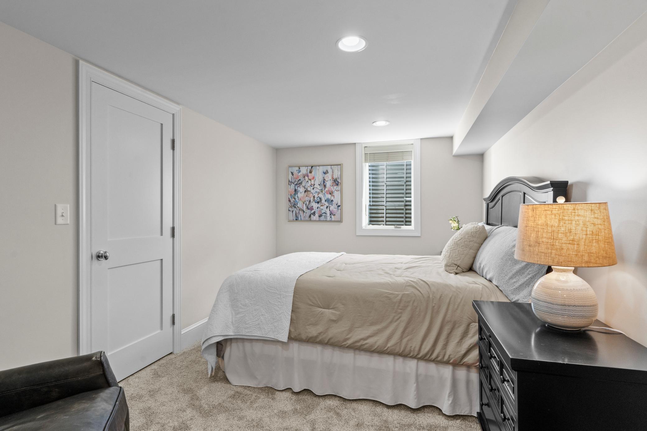 The third bedroom includes carpet, a walk-in closet, and an egress window.