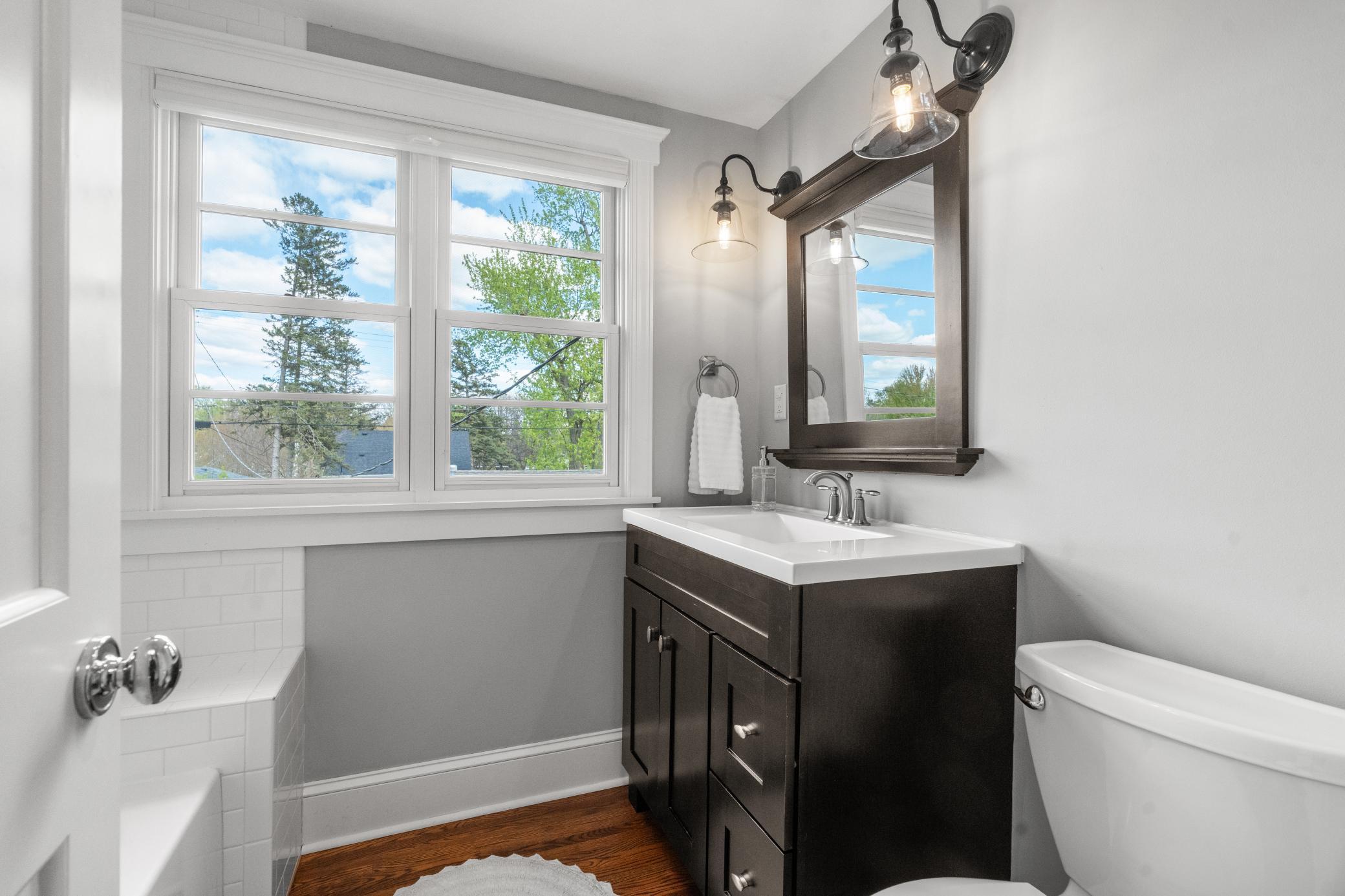 Both bedrooms are served by a full bathroom with a tub/shower combo and tile surround, along with a single vanity.