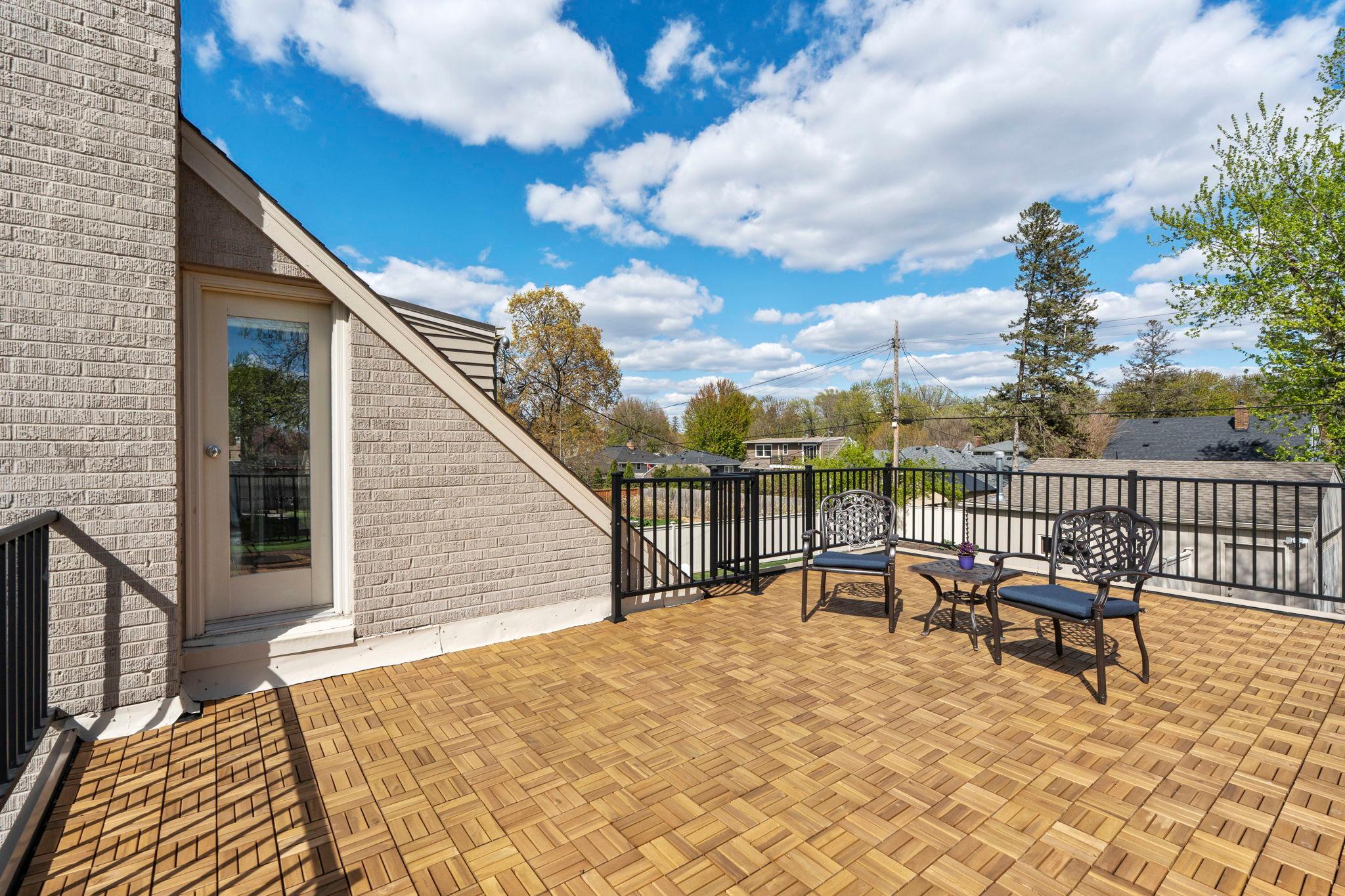 The recently completed private primary roof deck, located above the attached one-car garage, offers an ideal setting for morning coffee.
