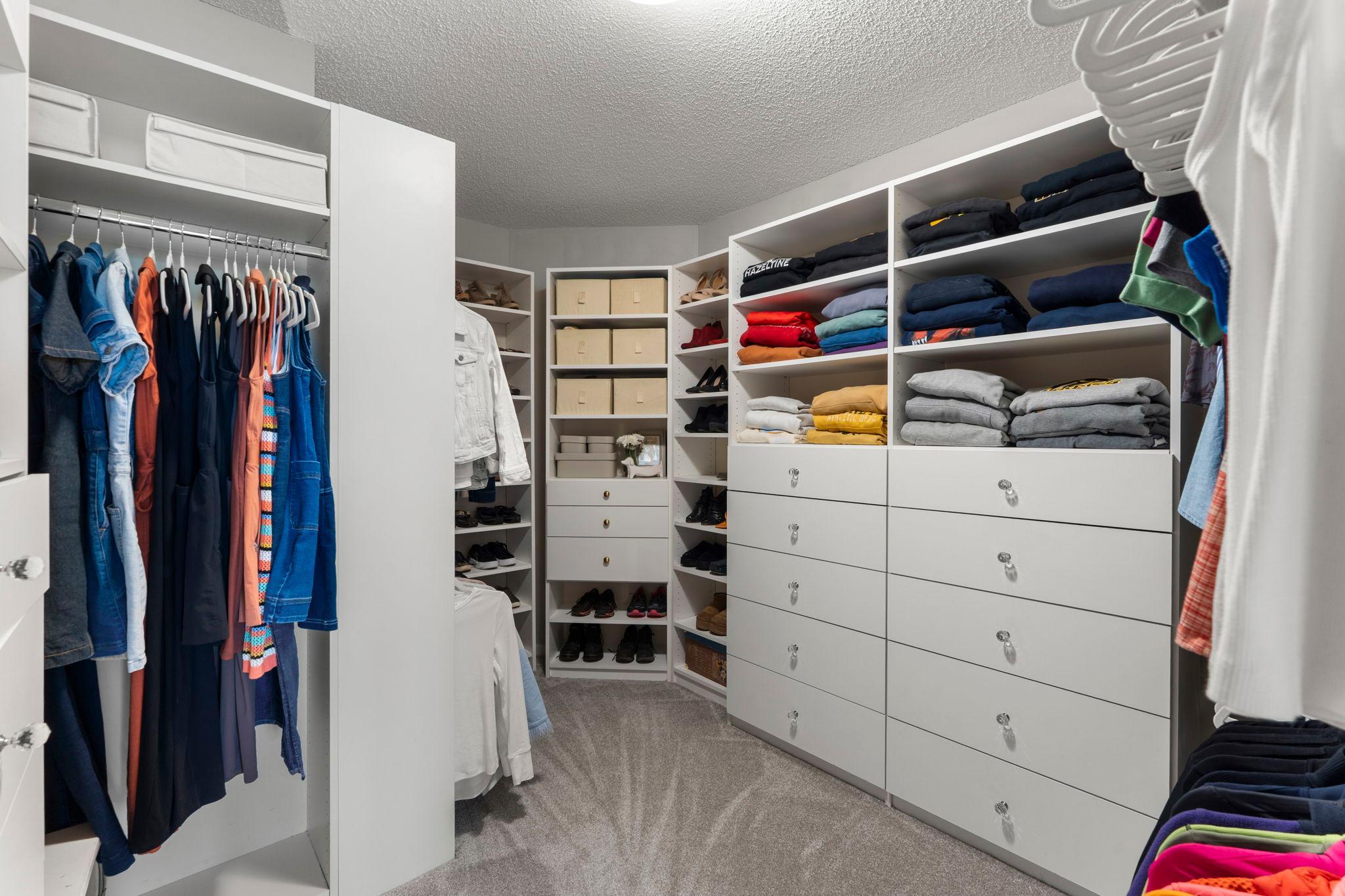 The suite also includes an impressive walk-in closet with custom built-ins for exceptional storage.