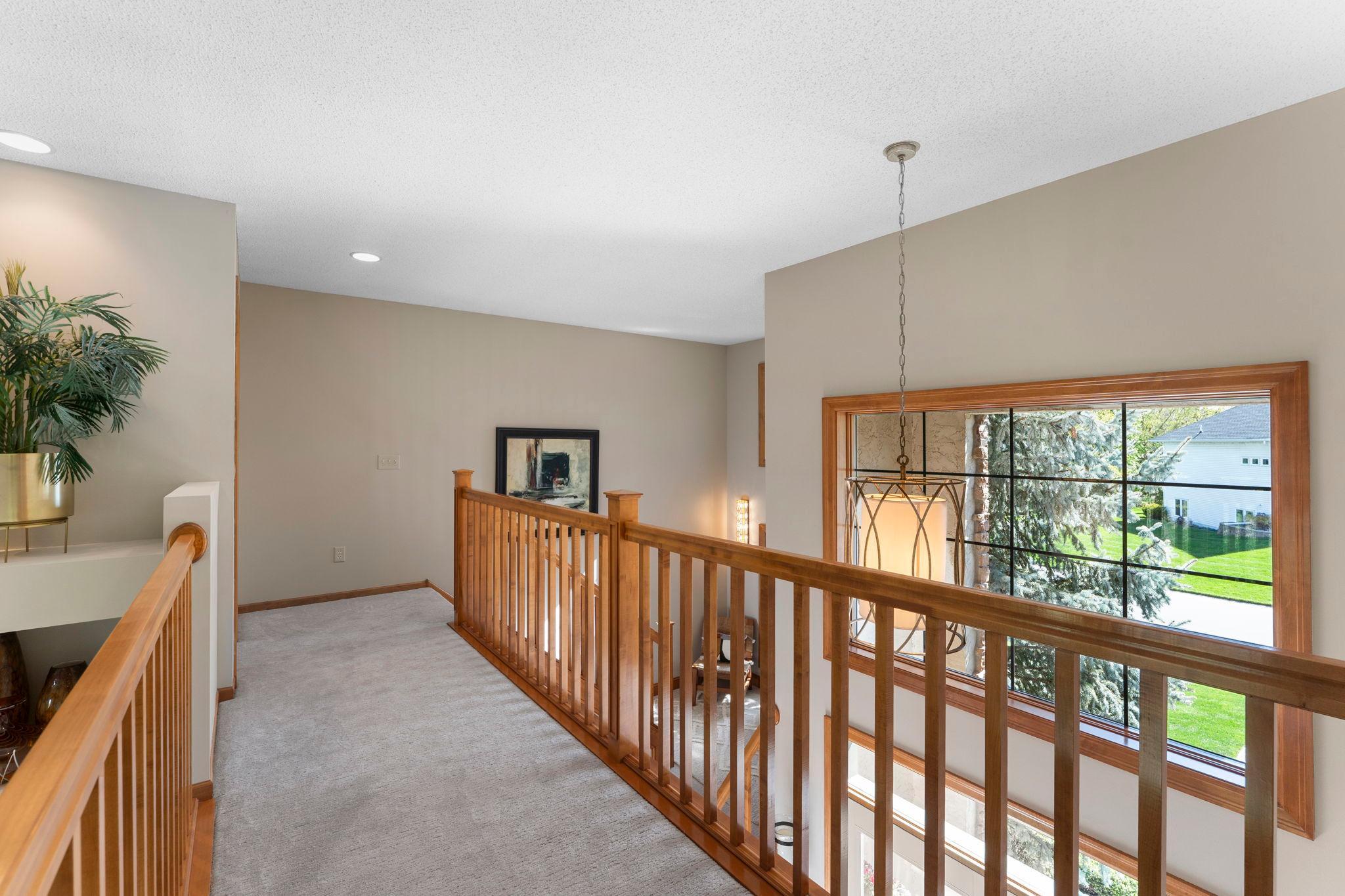 Across the catwalk, the third upper-level bedroom is situated.