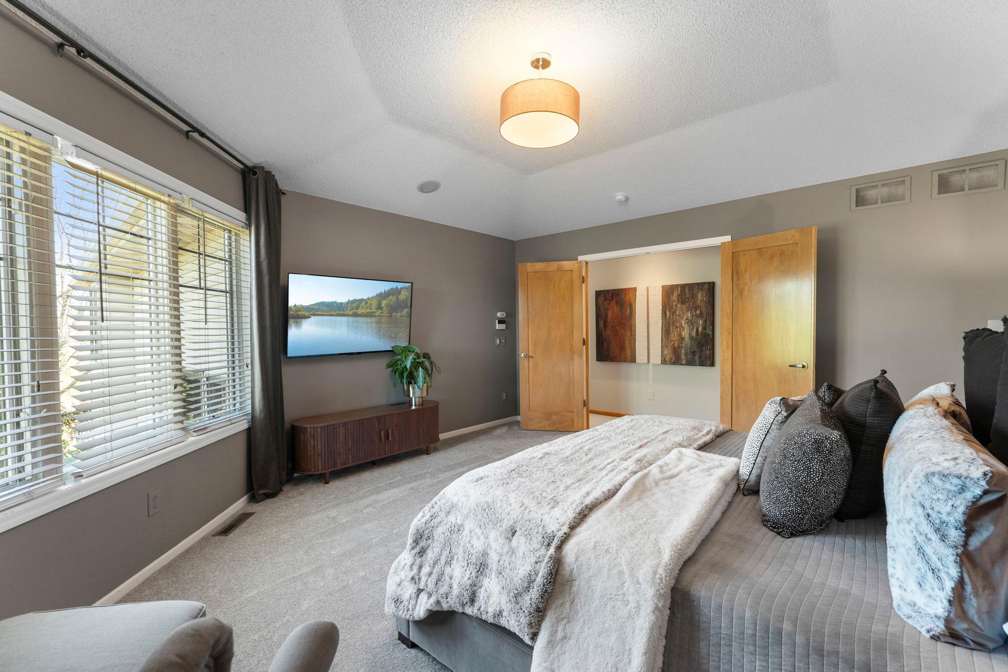 Another perspective of the spacious primary suite.