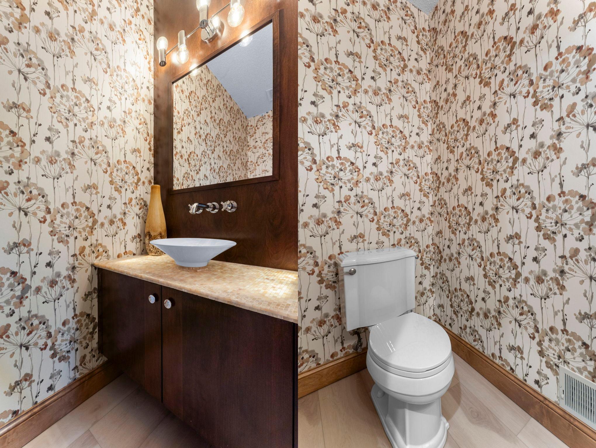 Nearby, you’ll find a convenient and stylish half bathroom.