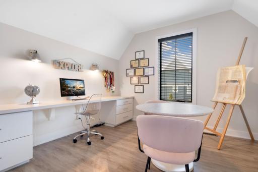 This flexible space offers endless possibilitiesâideal as a playroom, additional office, craft room, or creative workspace with built-in desk and cabinetry.