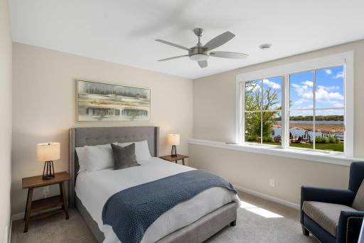 This level is completed by three additional bedrooms, each featuring carpeting and walk-in closets.