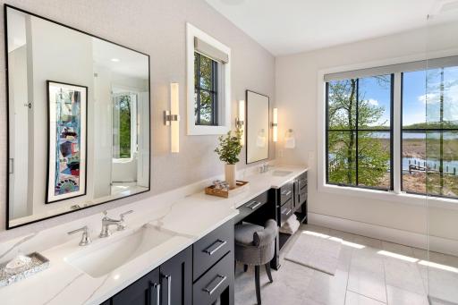 The private three-quarter primary bathroom is designed for comfort and luxury.