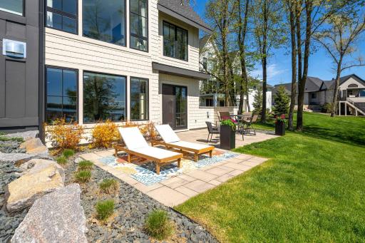 From the lower-level entertaining space, enjoy direct access to the expansive paver patio and beautifully landscaped backyardâan ideal setting for seamless indoor-outdoor entertaining.