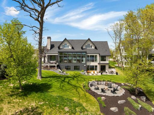 The yard is a true standout feature of this home, offering beauty and function from front to back.