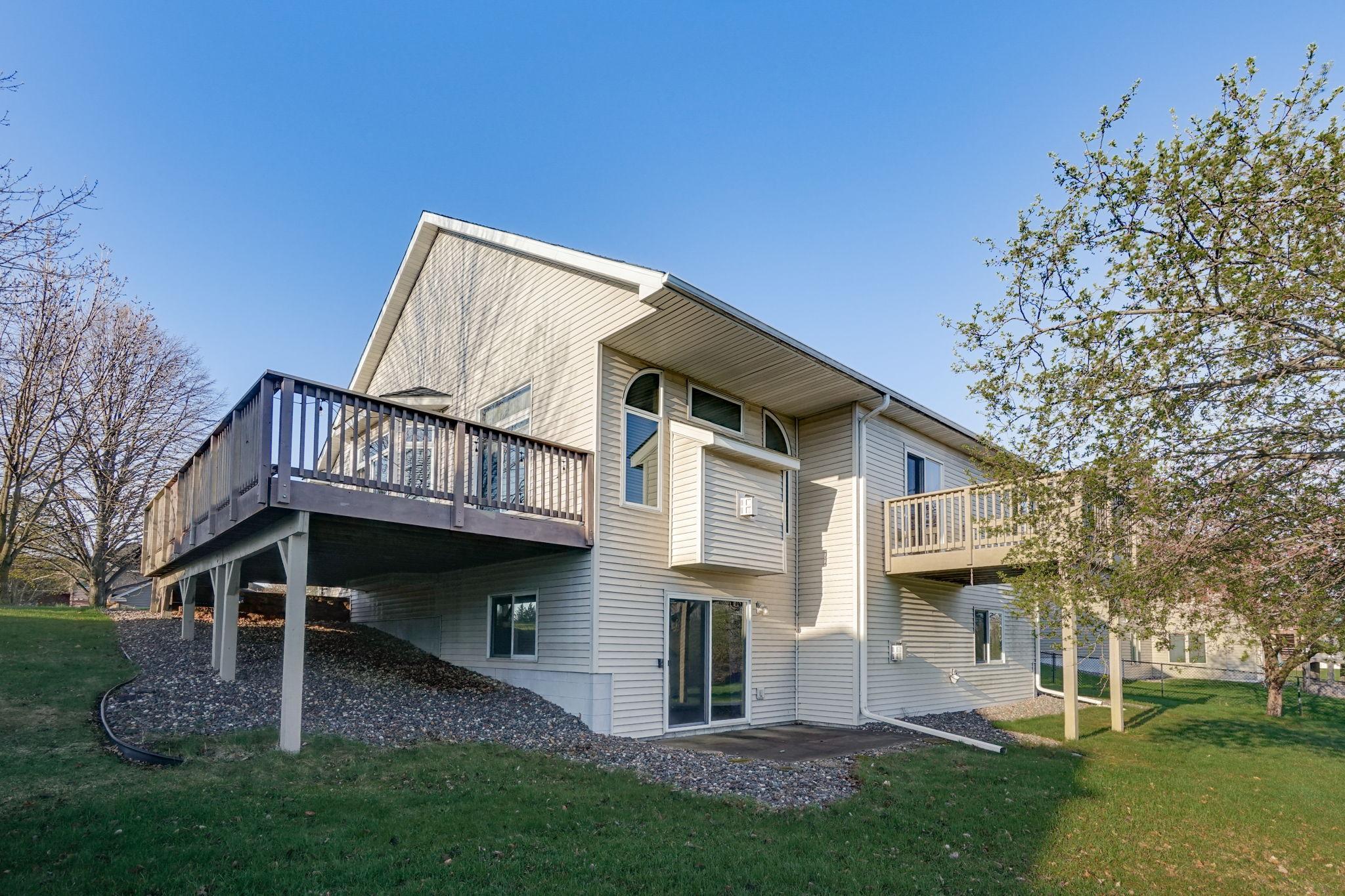 Enjoy outdoor living with two decks, one of which is privately accessible from the primary bedroom