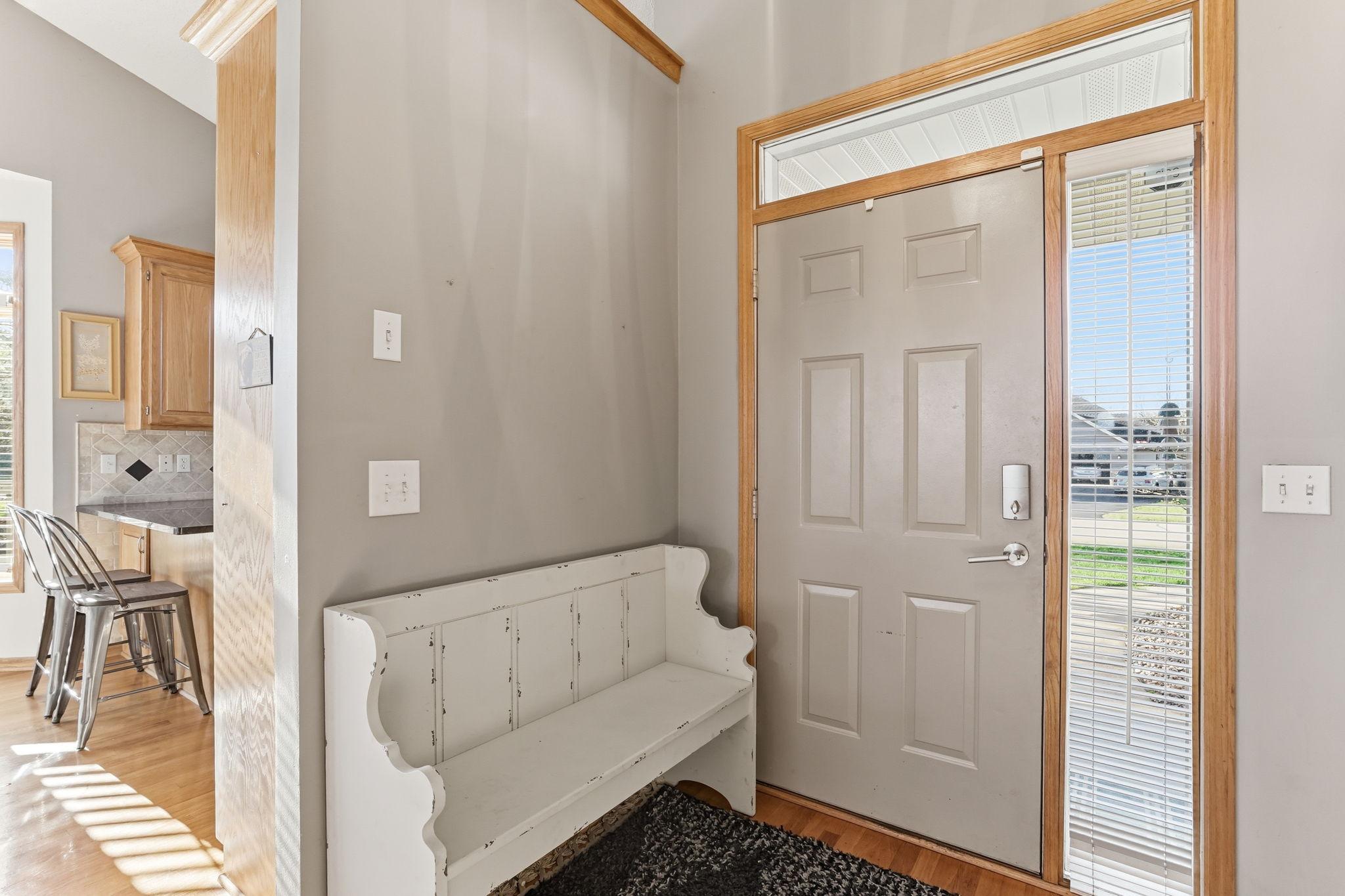 Inviting, open entryway with plenty of space for a bench.