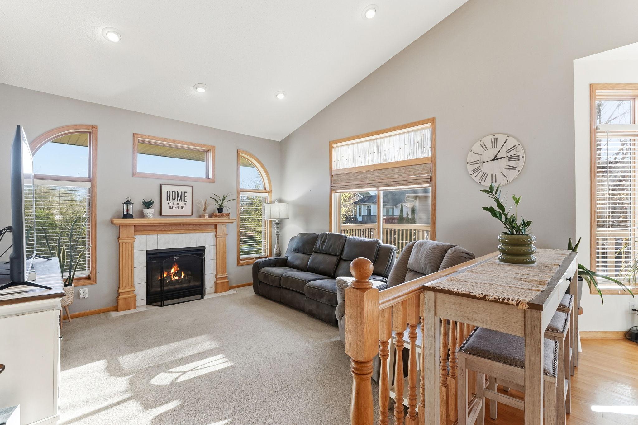 Abundant windows fill the room with light, creating a comfortable living space.