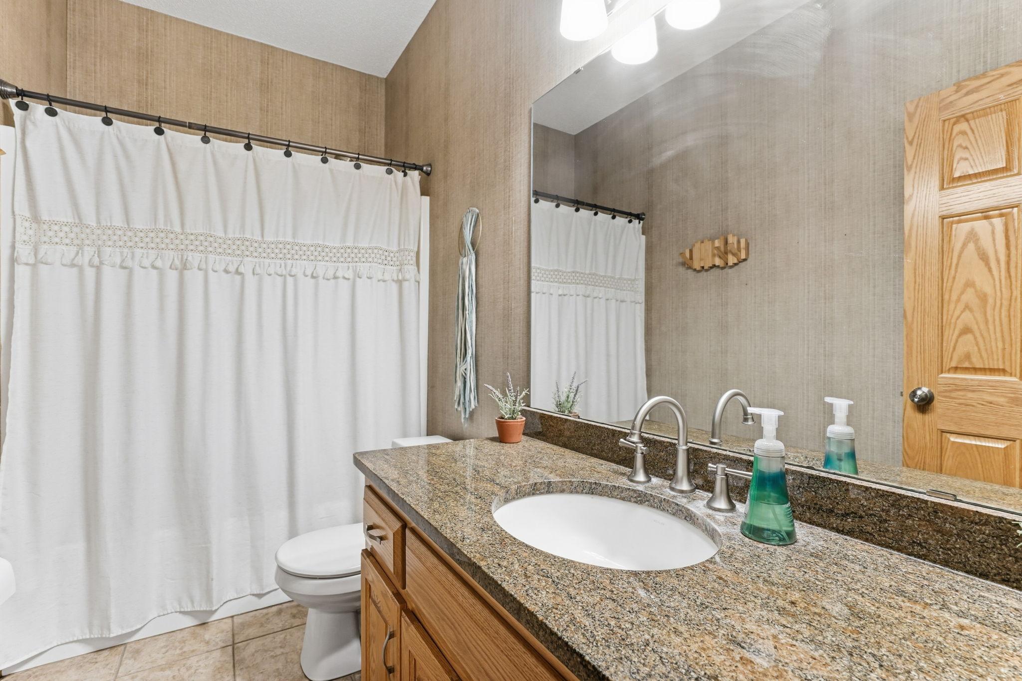 Extra full bath conveniently located on the main level.