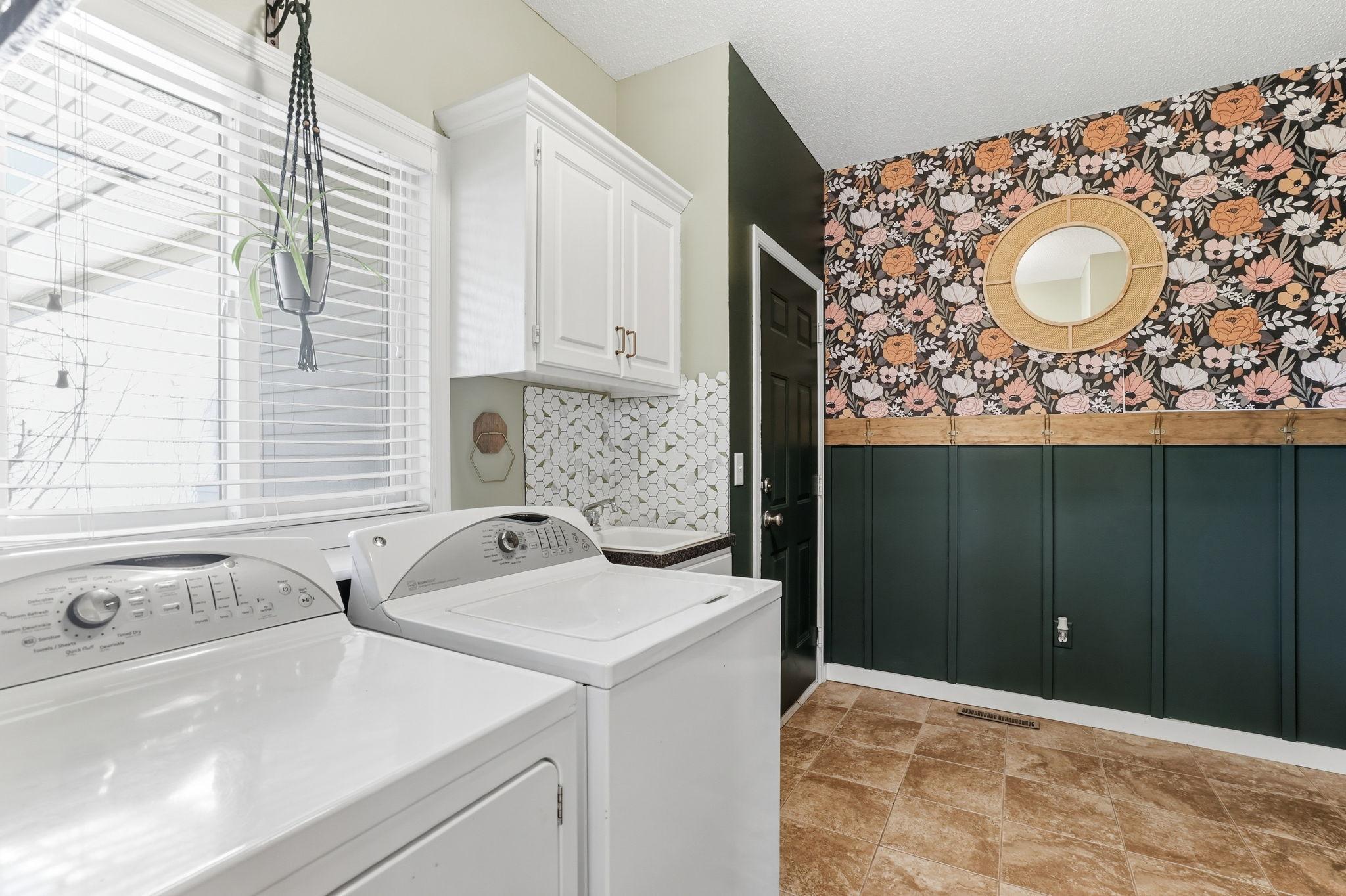 Main foor laundry with addition closet for storage.