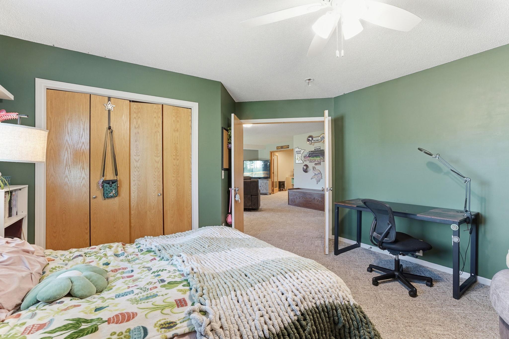 Third bedroom with a large closet and double doors.