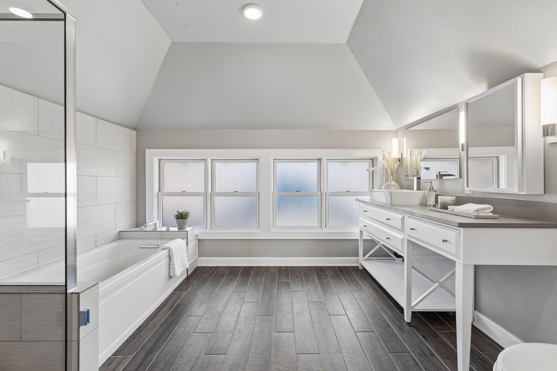 Private Primary bathroom with tub, walk in shower with oversized vanity