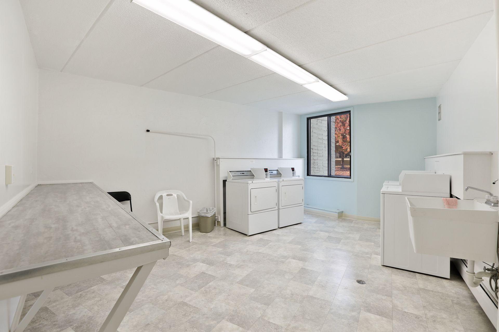 Laundry is just a few doors down the hall from the unit. Many owners have also opted to add in-unit laundry (which is an option in #515, as well). There is also a lockable private storage area for unit #515 here (not pictured).