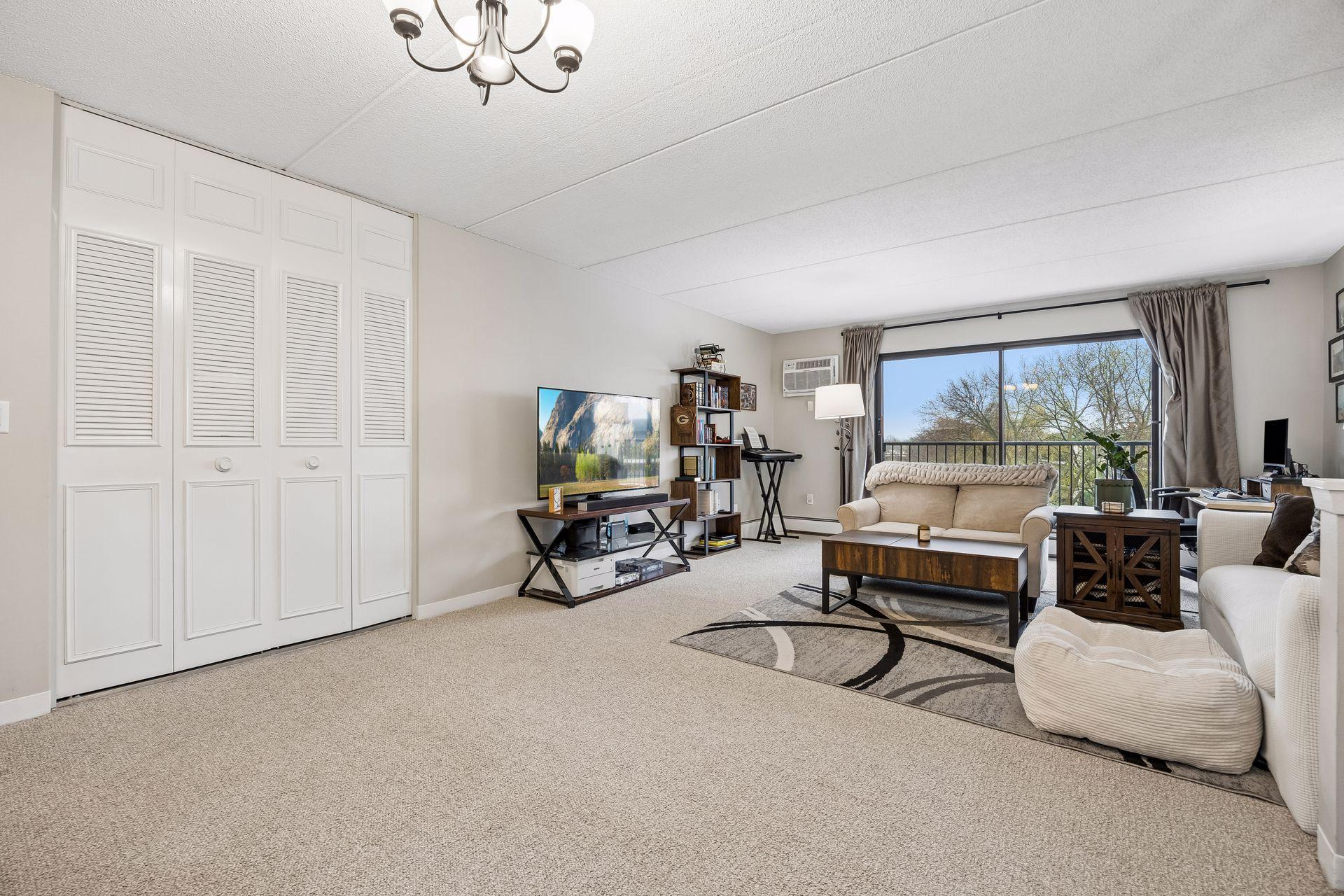 Open living and dining area allow for multiple uses. New carpet in 2022 (and it barely looks lived in).