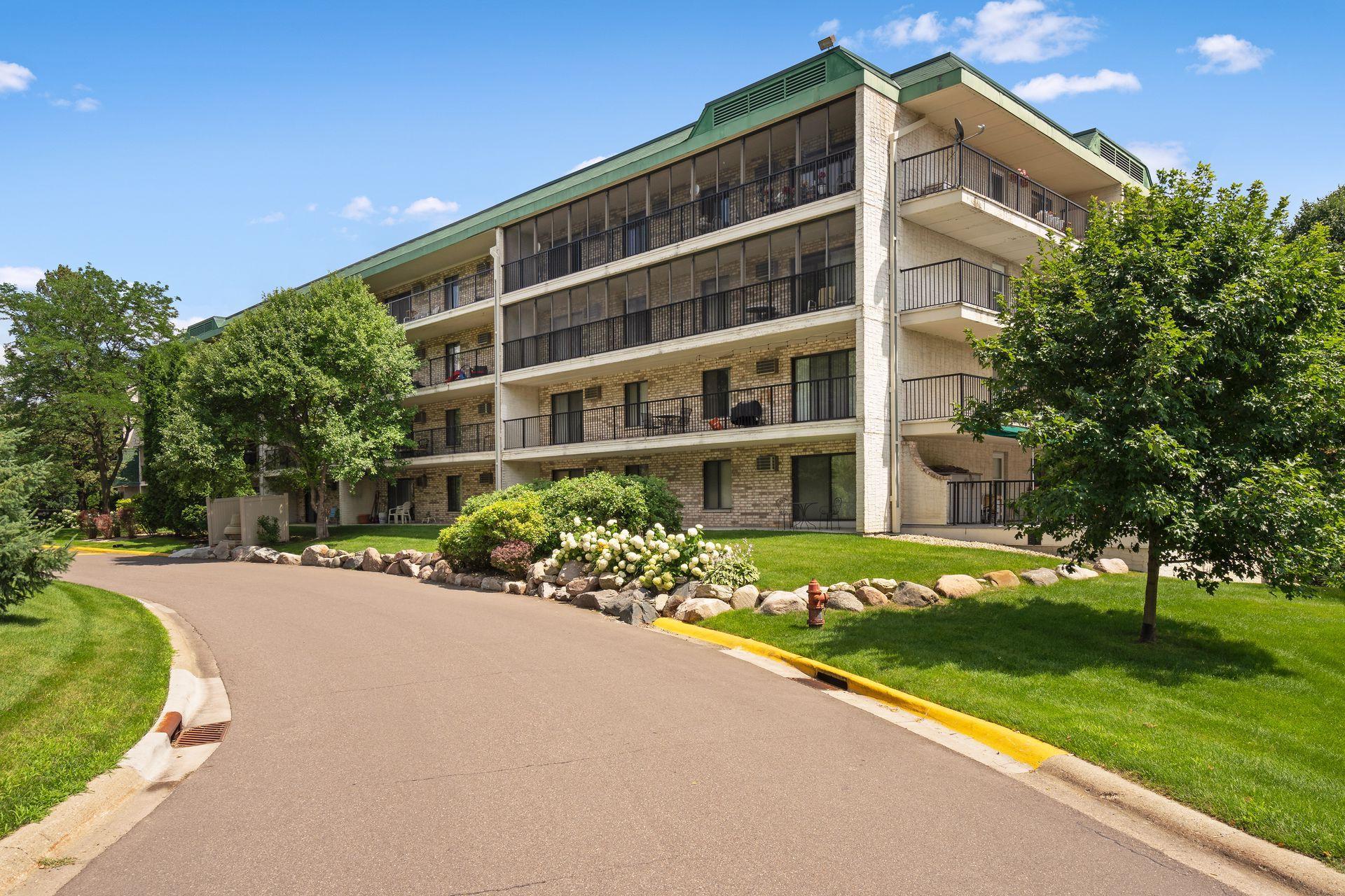 Lovely landscaping and sidewalks surround the well-manicured grounds.