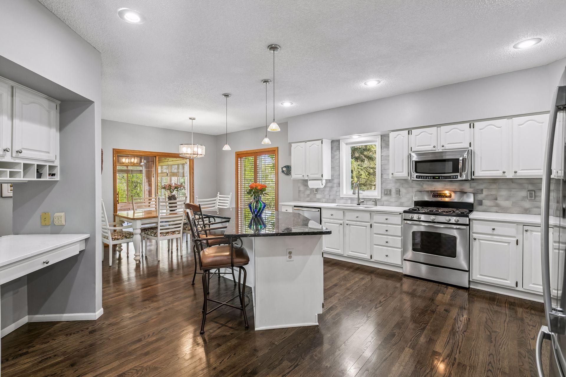 Center island, informal dining and door to porch