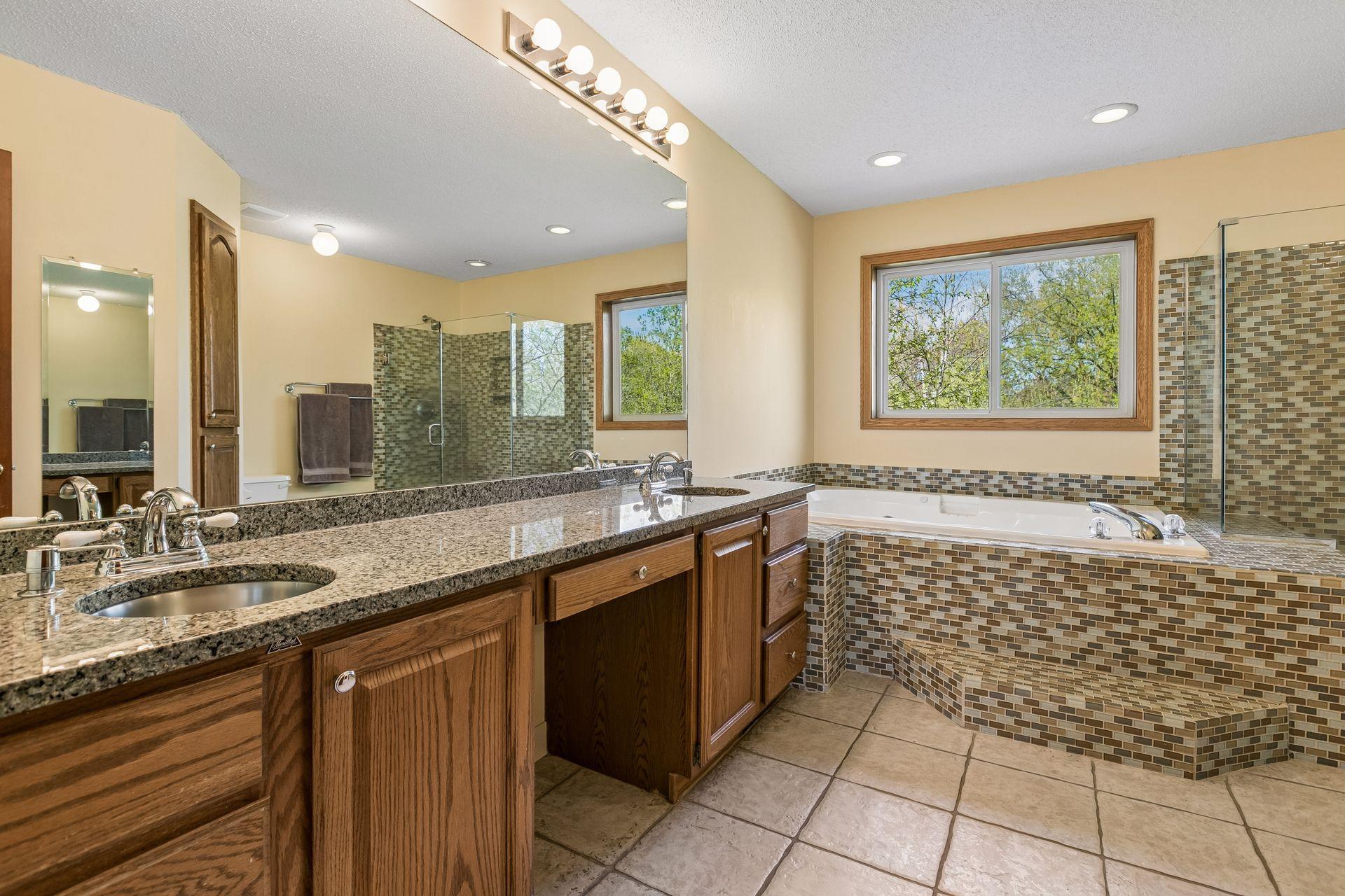 Primary bedroom with seperate shower and whirlpool tub
