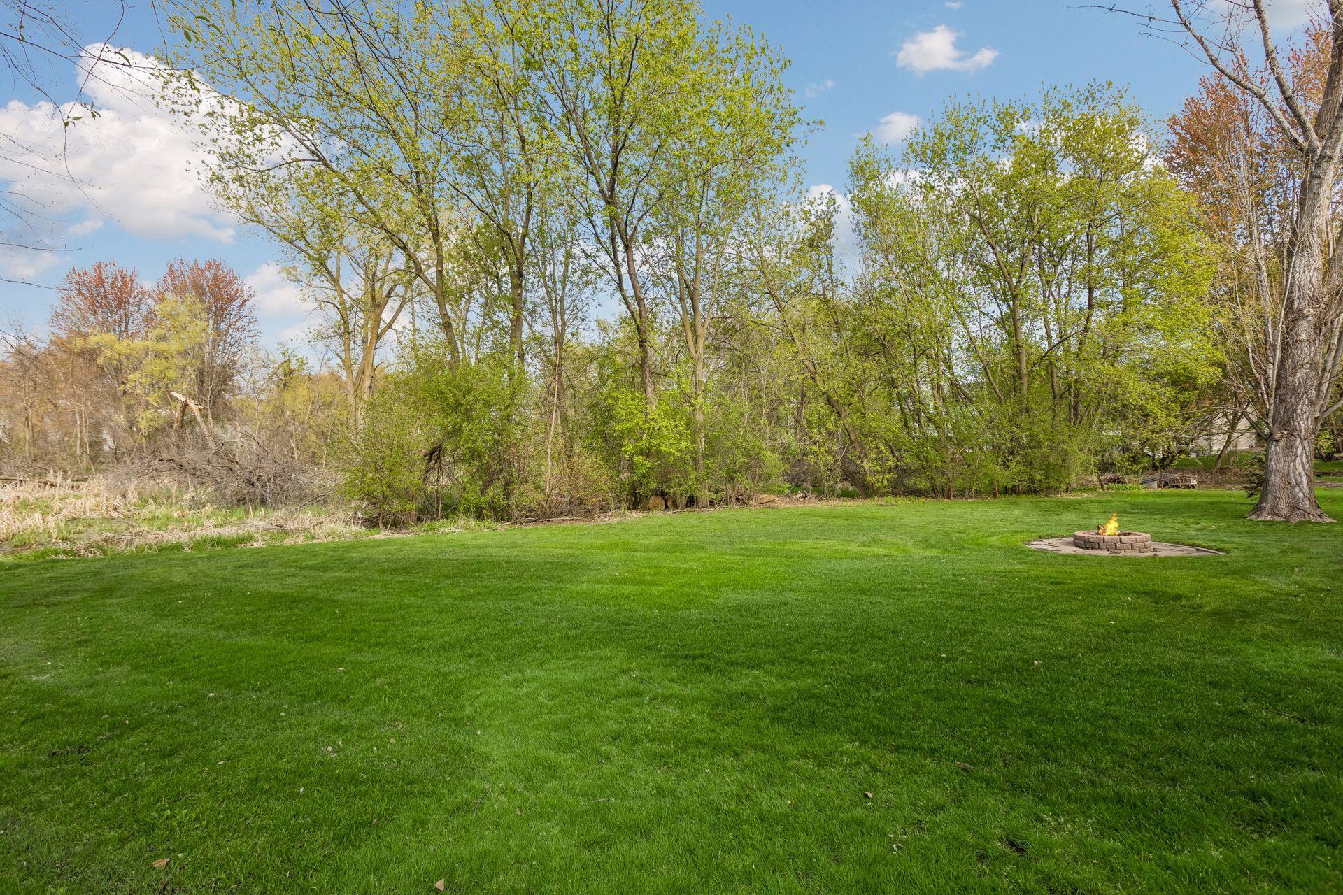 Flat yard and backing up to nature