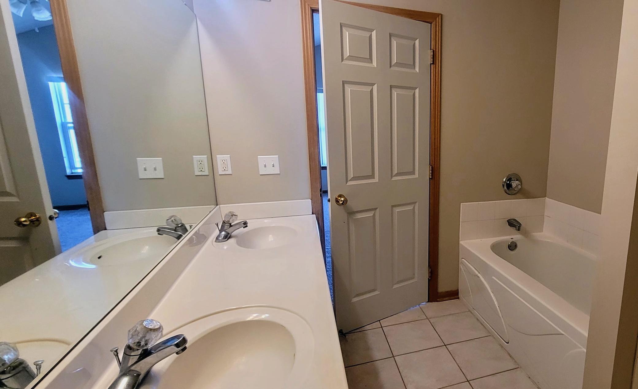Private bath with soaking tub and shower and large walkin closet