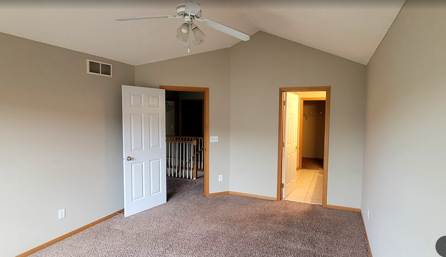 Large ensuite with vaulted ceiling that lead to private bath and large walkin closet