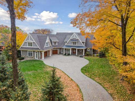 Grand approach and circular paver driveway makes for an unforgettable first impression