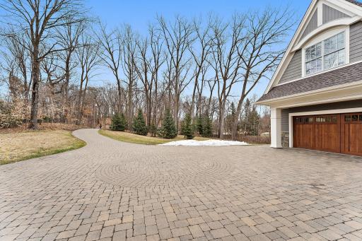 Beautiful long paver driveway with built-in lighting