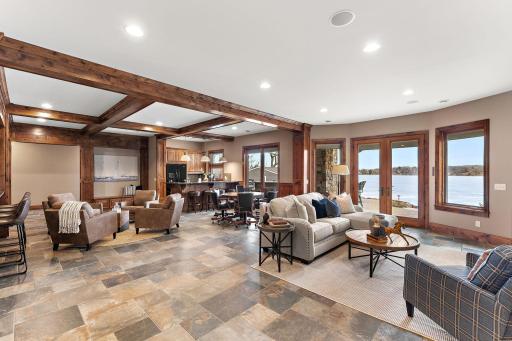 Spacious lower-level entertaining space with bar, lounge, and theater room