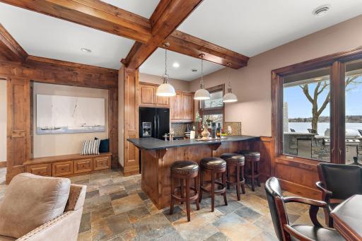 Lower-level kitchen features a dishwasher, ice maker and full-size refridgerator perfect for entertaining