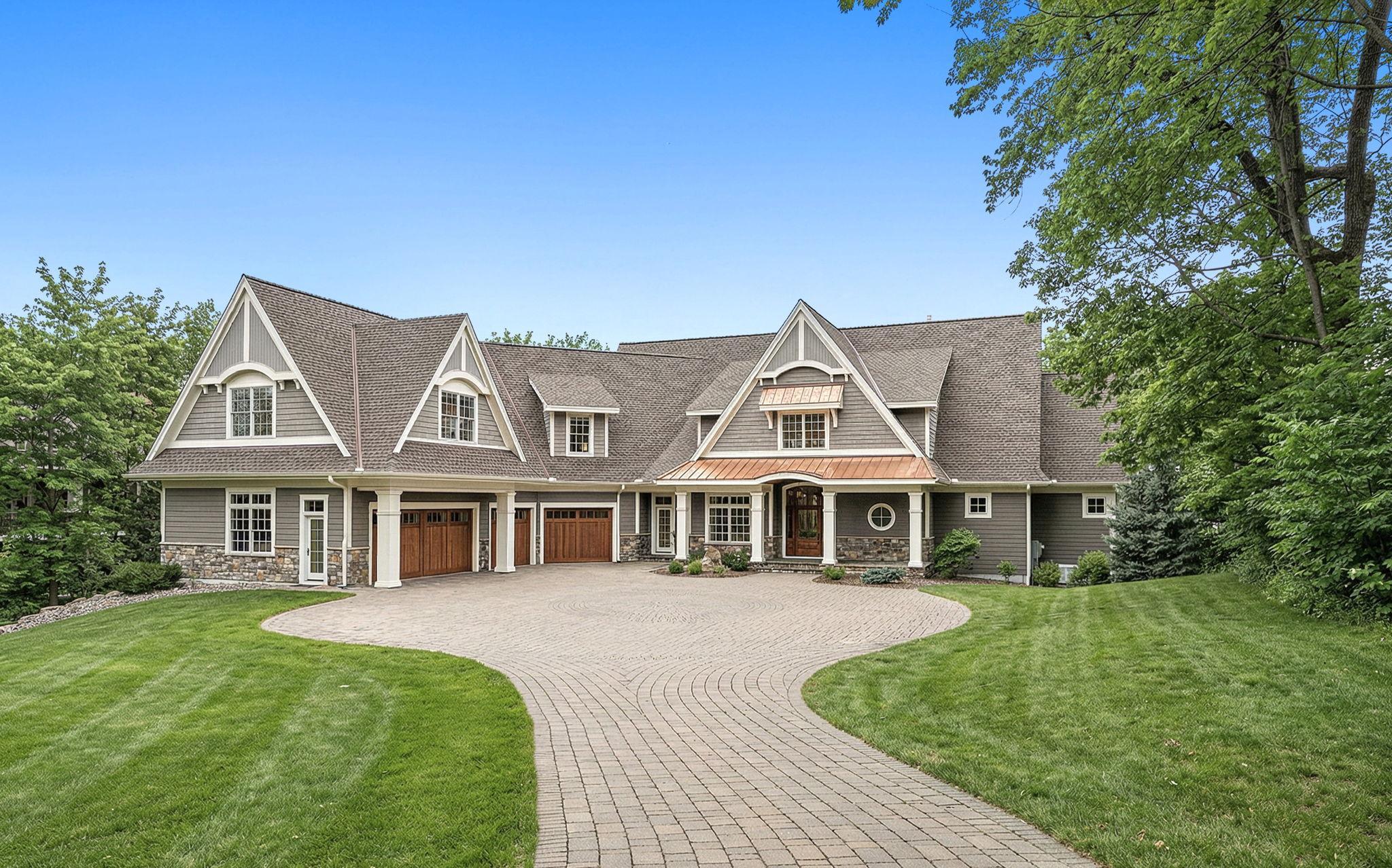 A premier estate offering a 4-car heated garage, nearly 10,000 sqft of living space, and set on nearly one acre