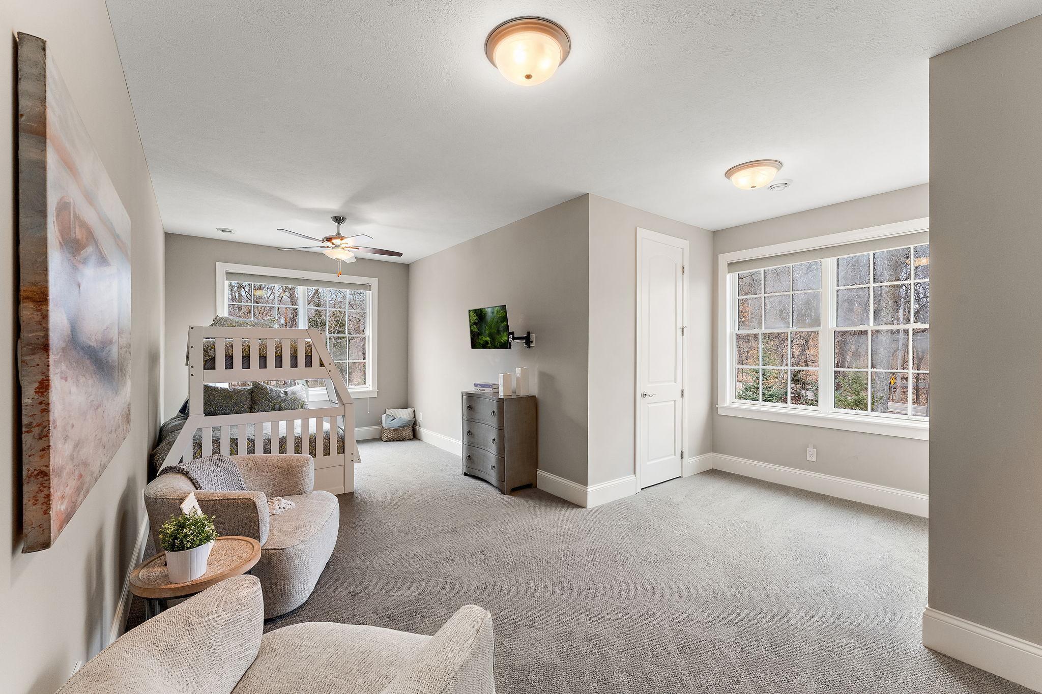 Upper-level in-law bedroom #5, a functional space designed to accommodate multiple guests or kids