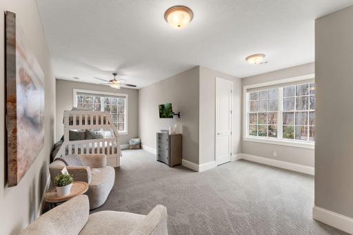 Upper-level in-law bedroom #5, a functional space designed to accommodate multiple guests or kids