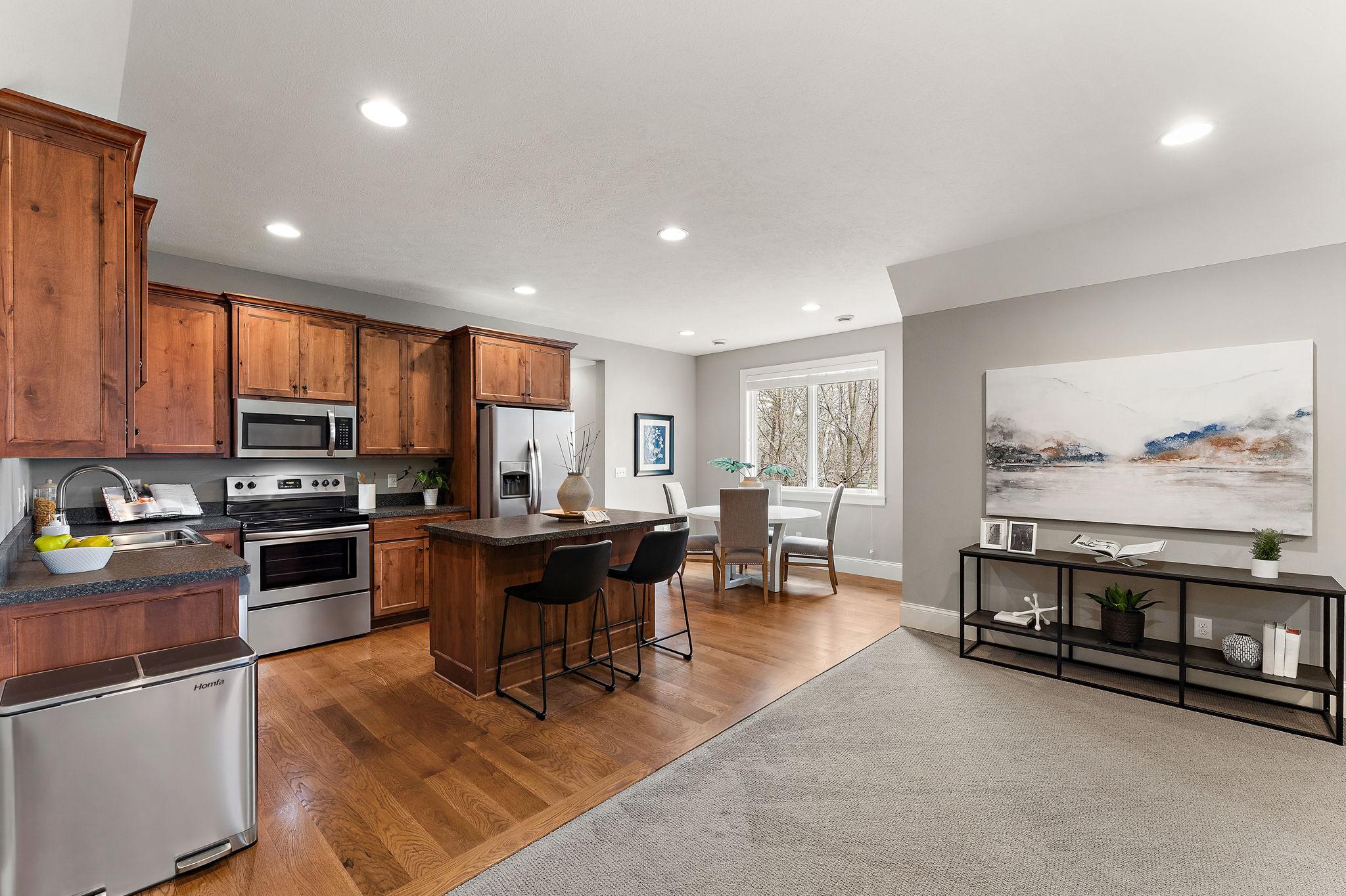 Upper-level attached in-law suite with private entrance, offering a true second living environment