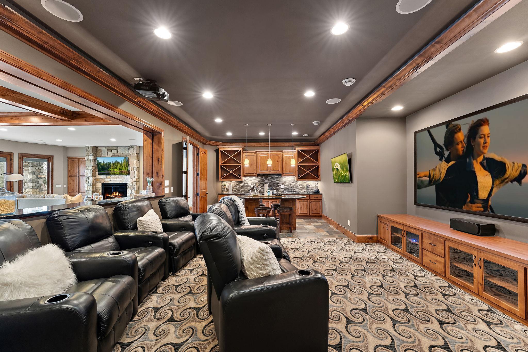 Theater room featuring leather recliners for ultimate comfort during movie nights