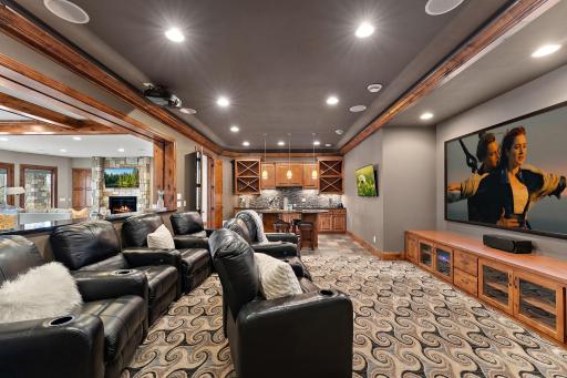 Theater room featuring leather recliners for ultimate comfort during movie nights