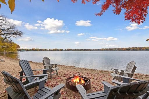 Private sandy beach with firepit, ideal for lakeside gatherings and relaxed evenings with friends and family