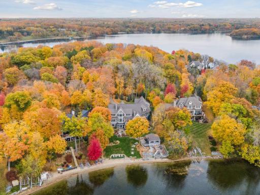 A private estate surrounded by mature trees and picturesque views of Lake Minnetonka