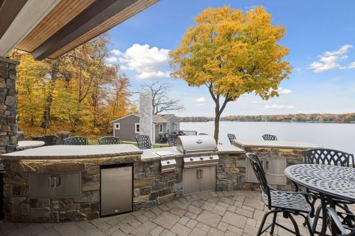 Paver patio and outdoor grill perfectly positioned to take in the lake views while grilling