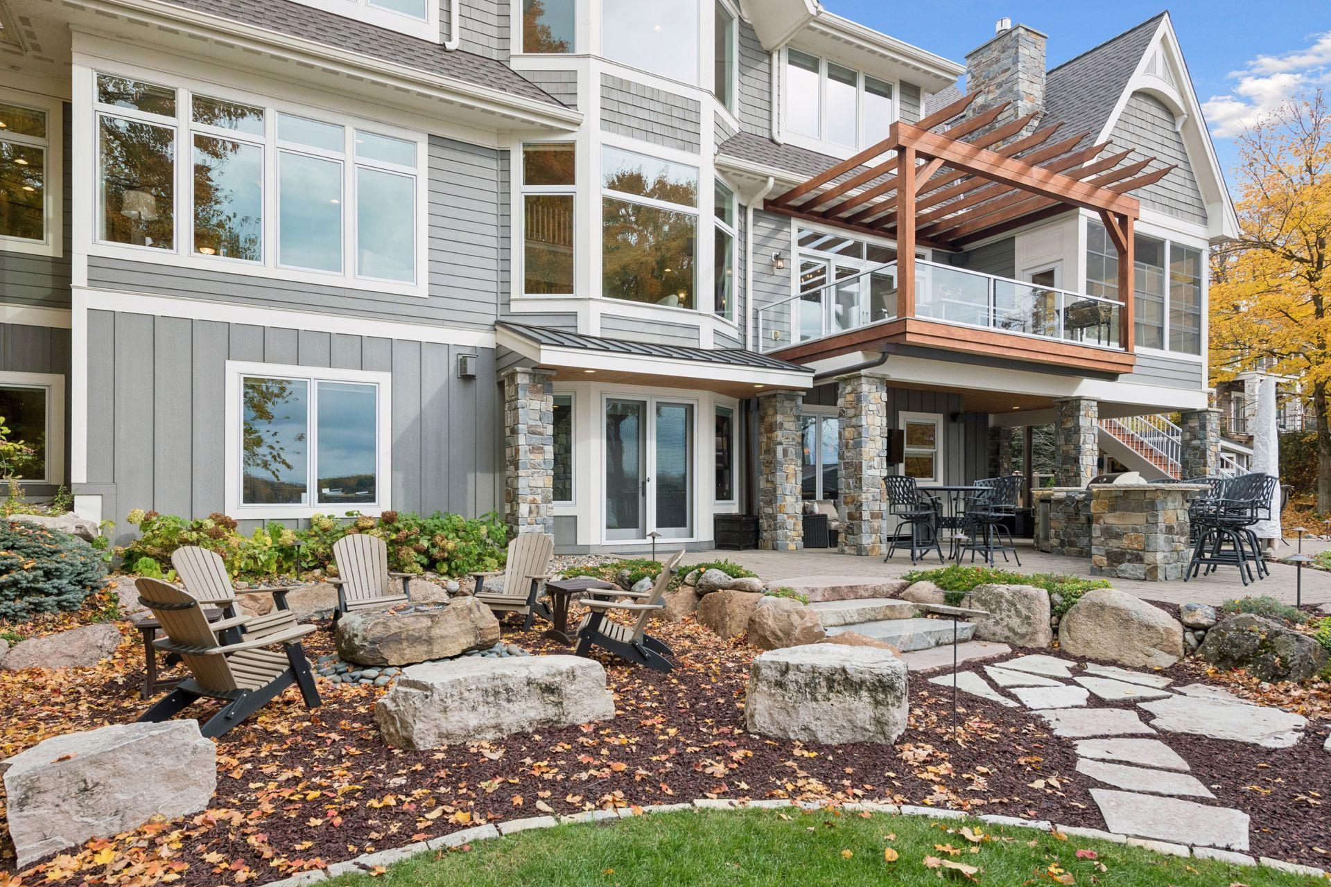 Newly stained pergola and new cedar mulch enhancing the beautiful landscape